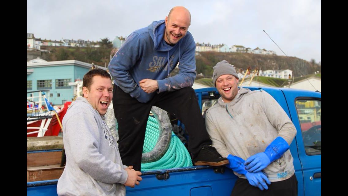 Crew laughing at the harbour