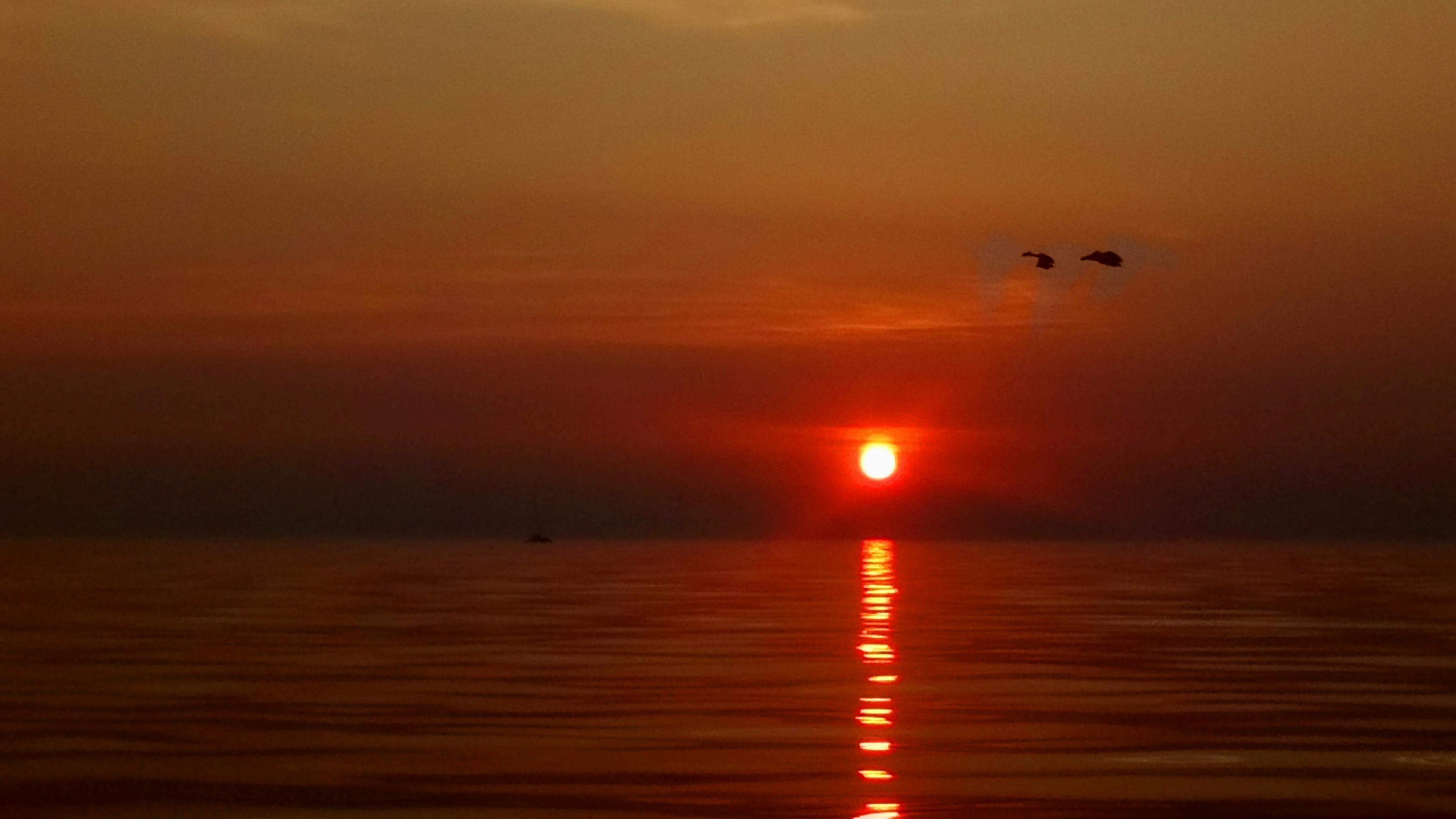 Fiery red sunrise over a calm sea