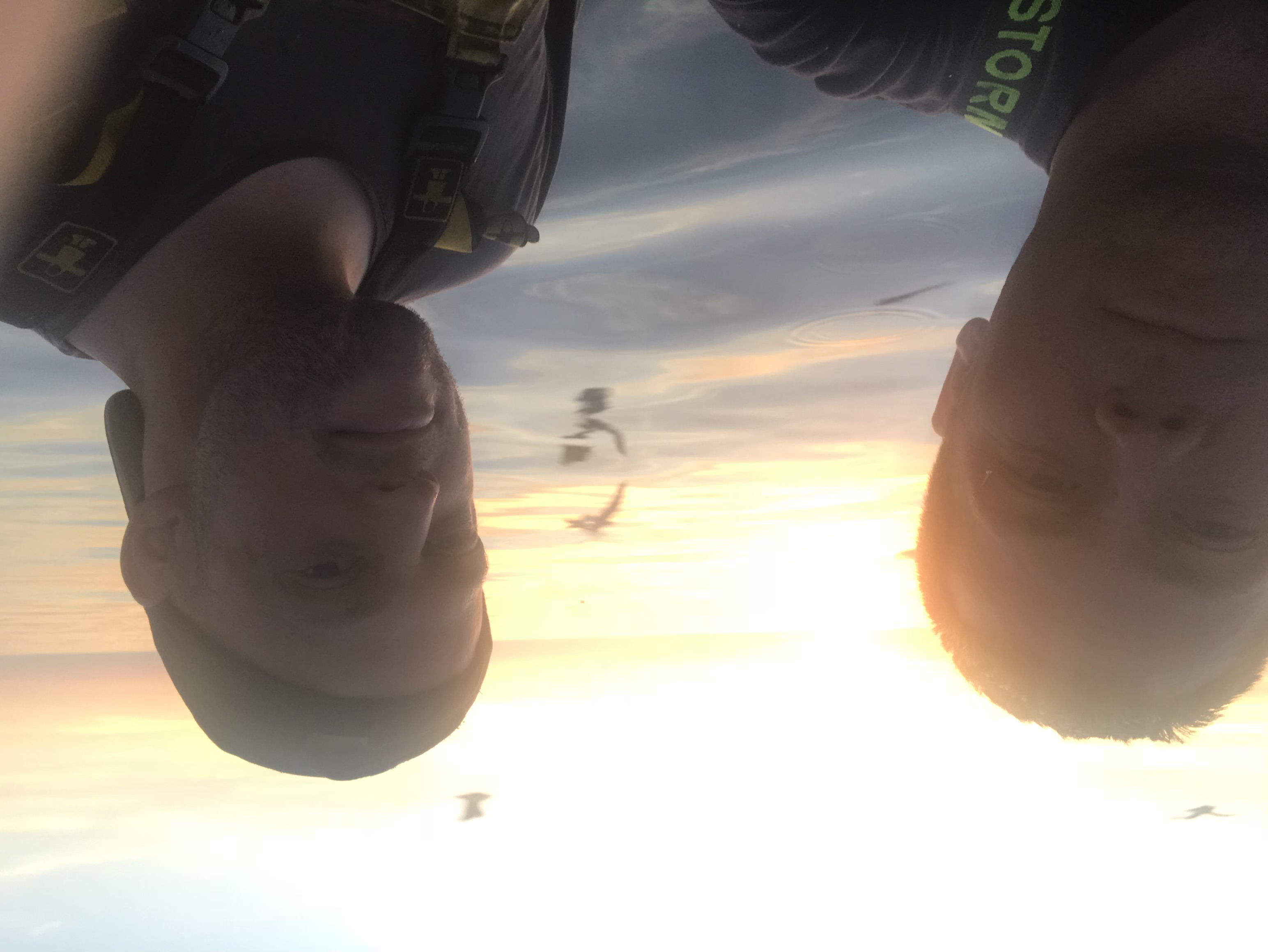 Two crew at dawn out at sea