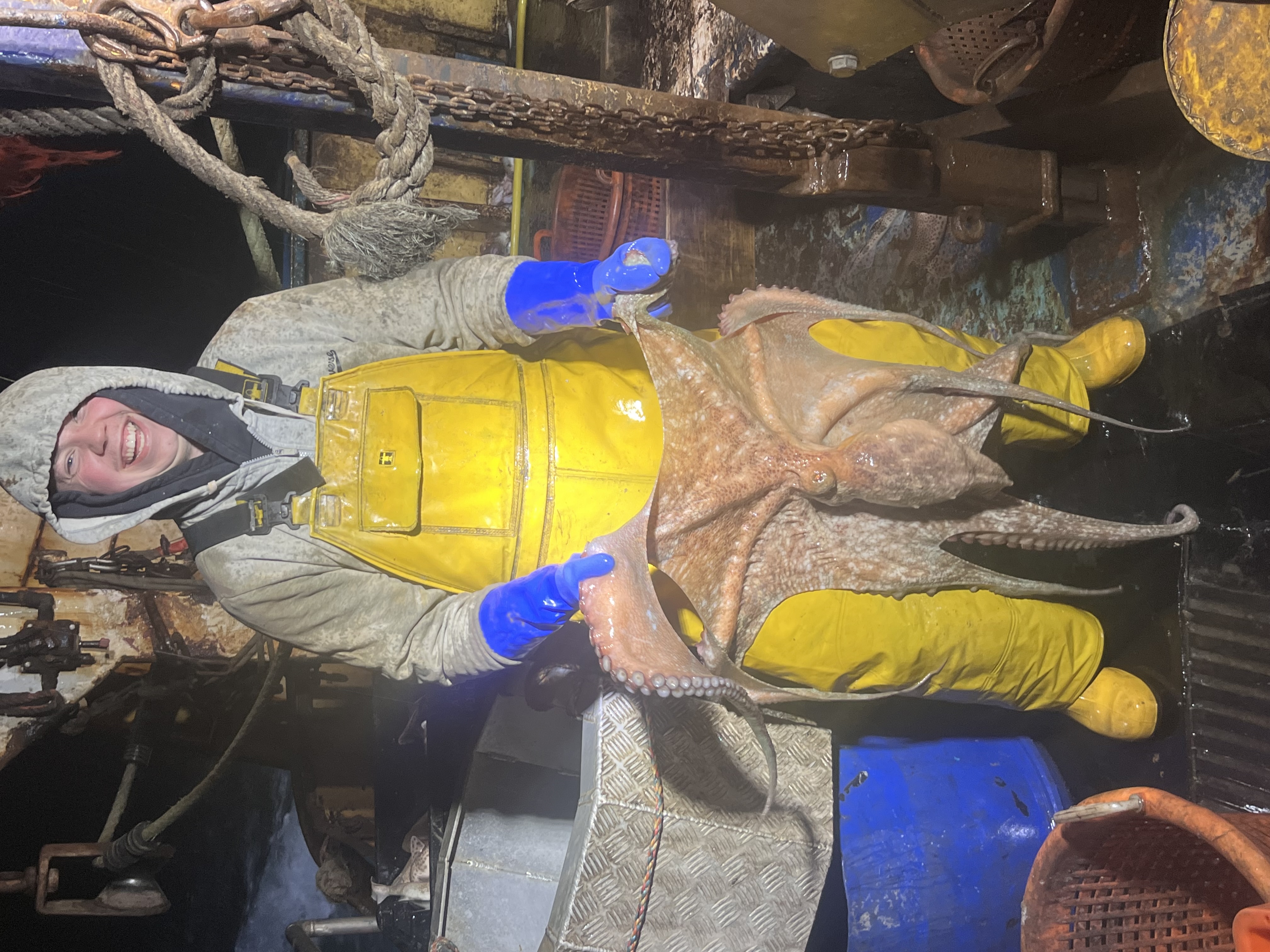 Crew member holding a giant octopus