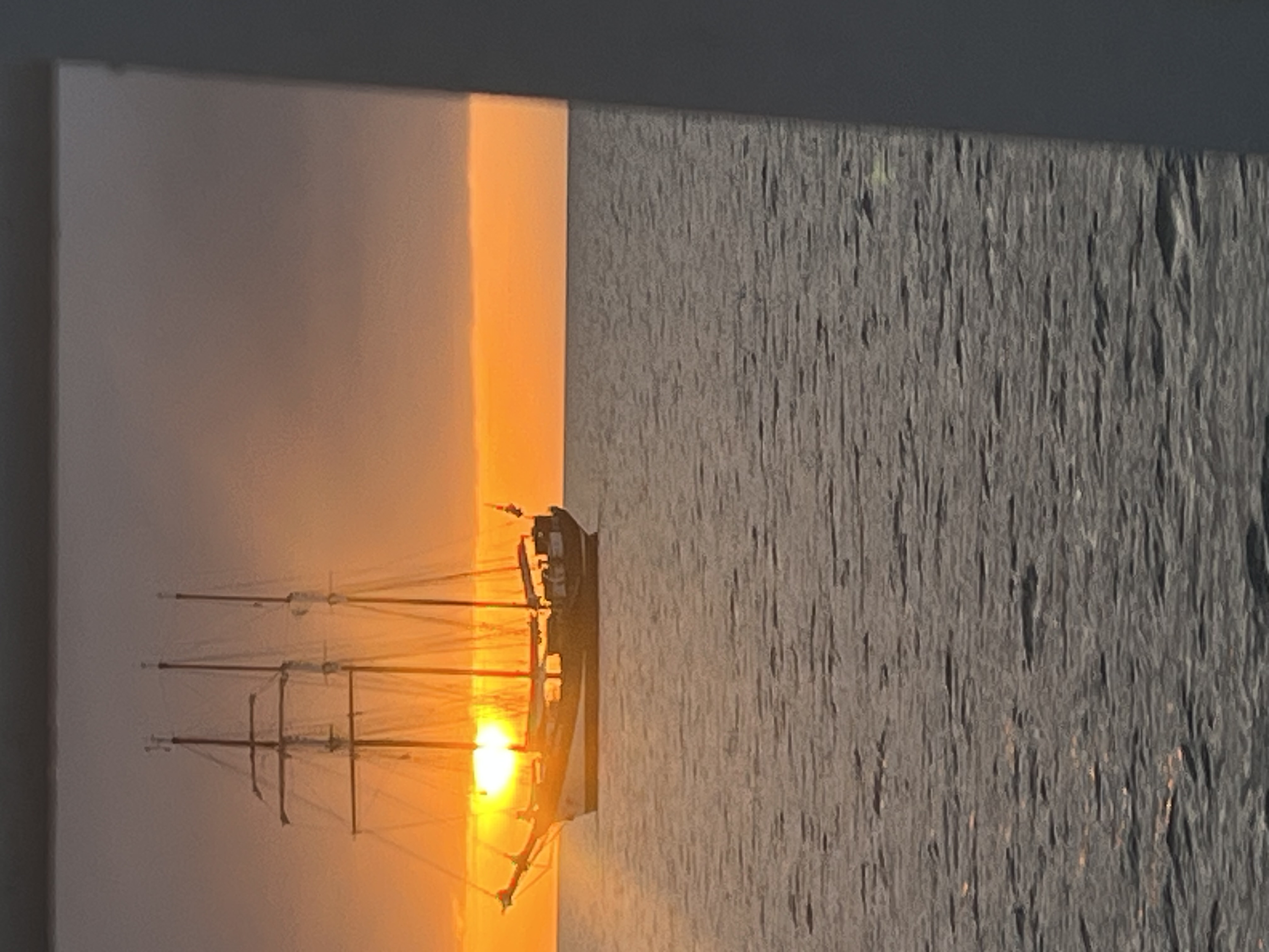 Tall ship silhouette at golden sunset
